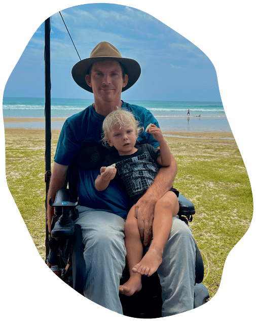 hydrotherapy at quad care, man with quadriplegia with child