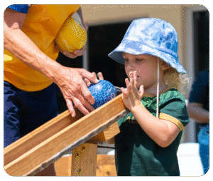 Child following verbal directions learning a new skills - bowling